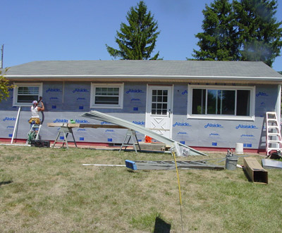 Workers Replacing Siding