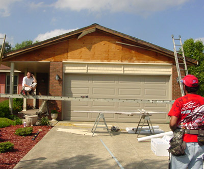 Clear Choice Home Improvements Crew Replacing Siding Over Garage Door