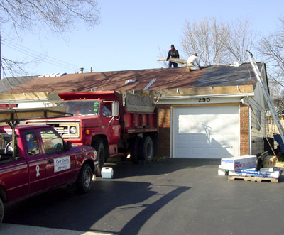 Workers Replacing Roof