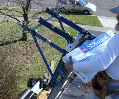 Workers Bring Shingles to Roof